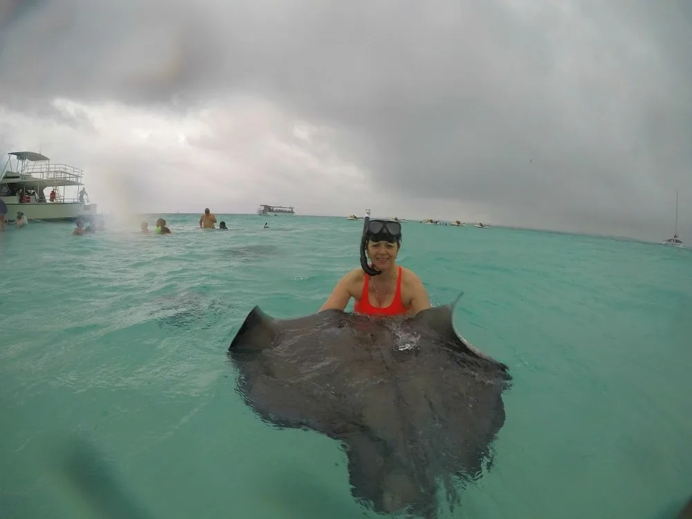 Holding the Stingray at Stingray City in Grand Cayman Photo Heatheronhertravels.com
